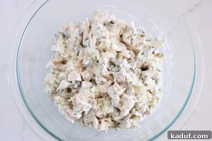 Tangy Dill Pickle Chicken Salad Recipe 7 Glass bowl with creamy dill pickle chicken salad.
