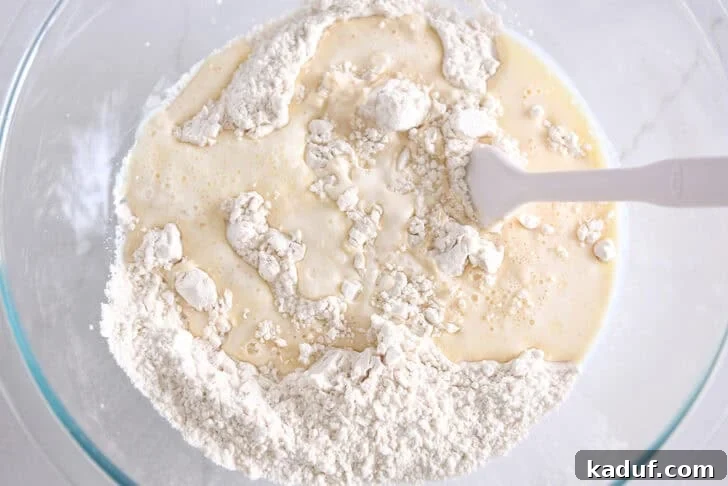 Fluffy Cinnamon Roll Bites: Mini Sweet Pastries 3 Glass bowl with flour and butter and hot water.