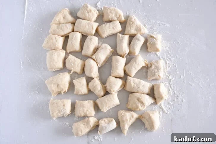 Fluffy Cinnamon Roll Bites: Mini Sweet Pastries 5 34 pieces of dough on lightly floured counter.